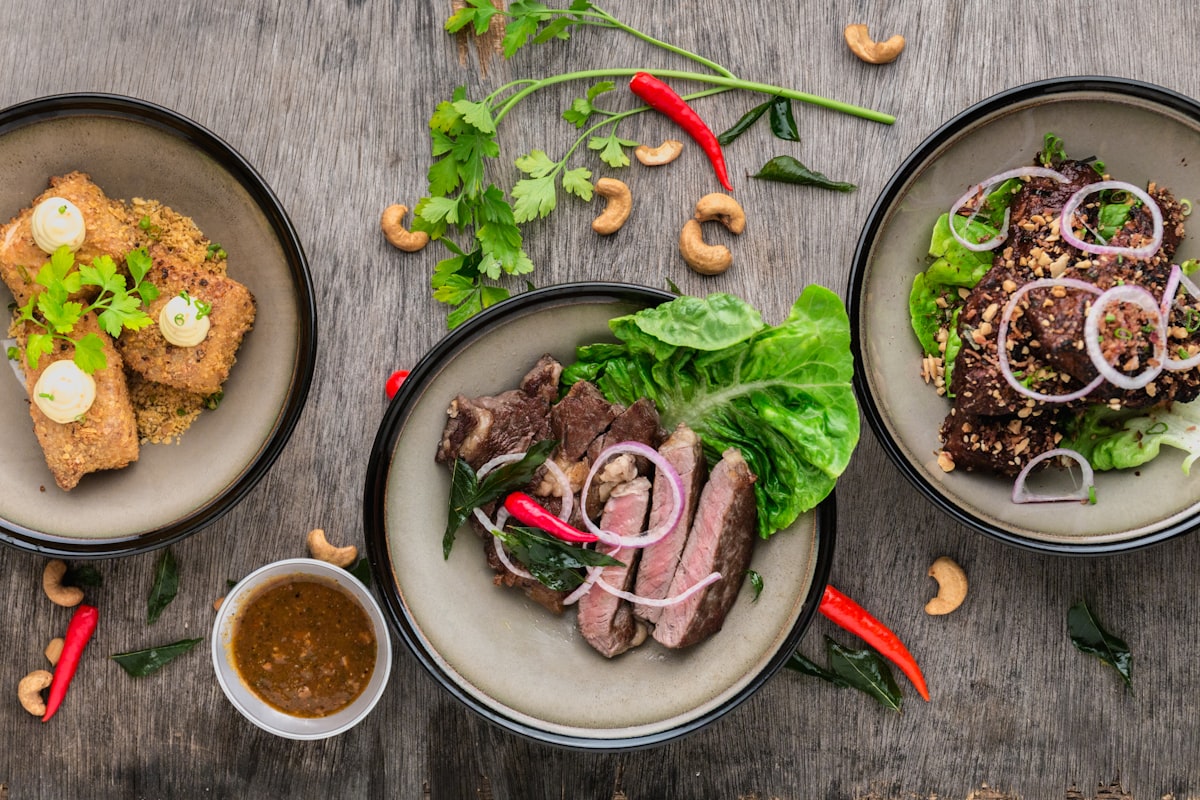 Outdoor summer cookout spread representing Fourth of July holiday nutrition and how kale's electrolytes, sulforaphane, and antioxidants help your body handle heat, grilling, and holiday indulgence