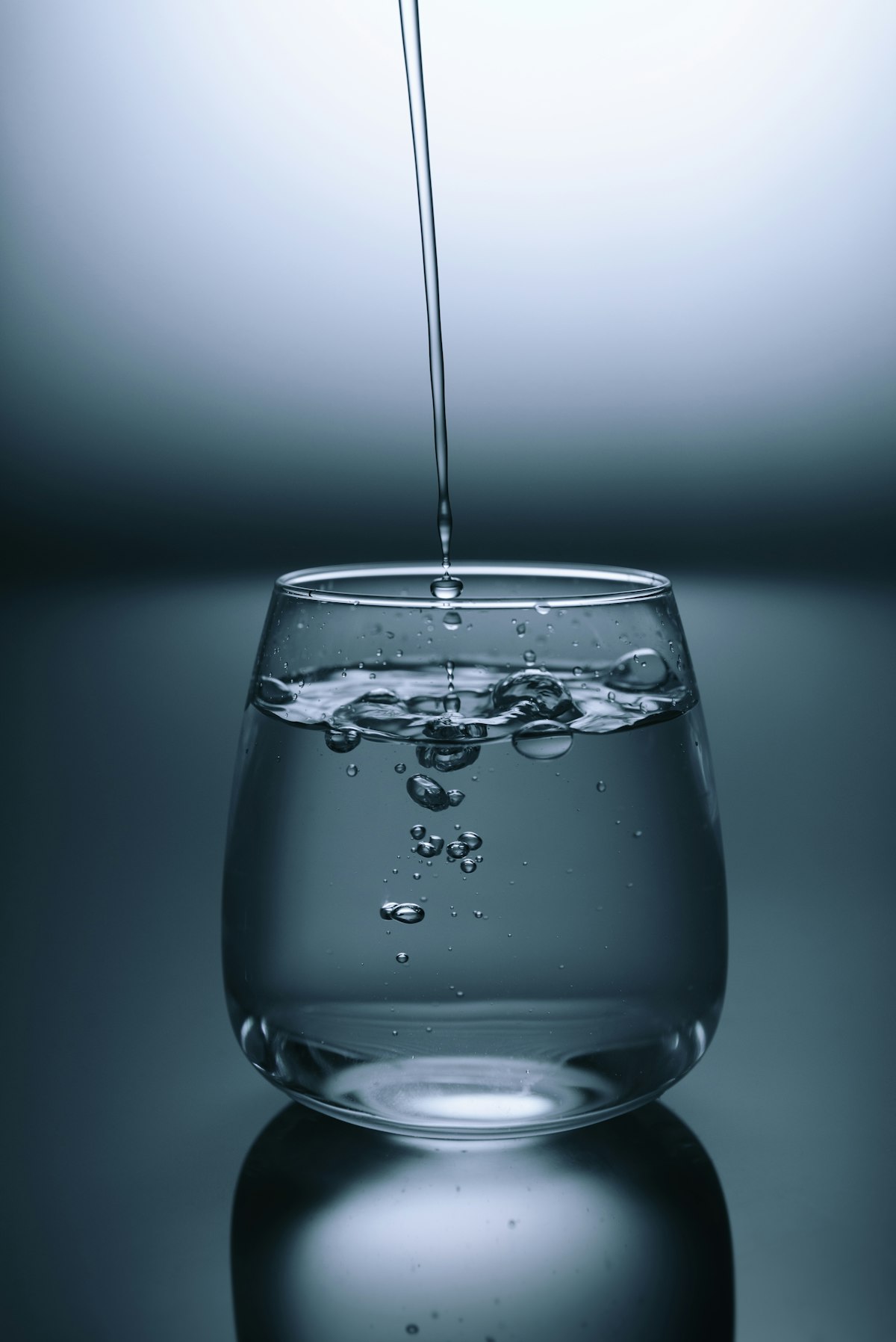Clean water droplets representing how kale's sulforaphane, quercetin, chlorophyll, and fiber help your body defend against microplastic exposure and environmental toxicants